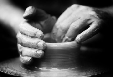 Dori Kite 21 Hands of a potter. Potter making ceramic pot on the pottery wheel
